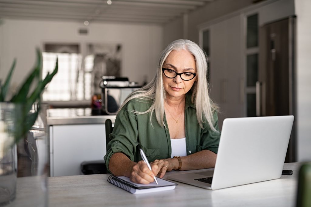older woman working on laptop