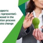 woman representative holding sustainable light bulb next to title of news item